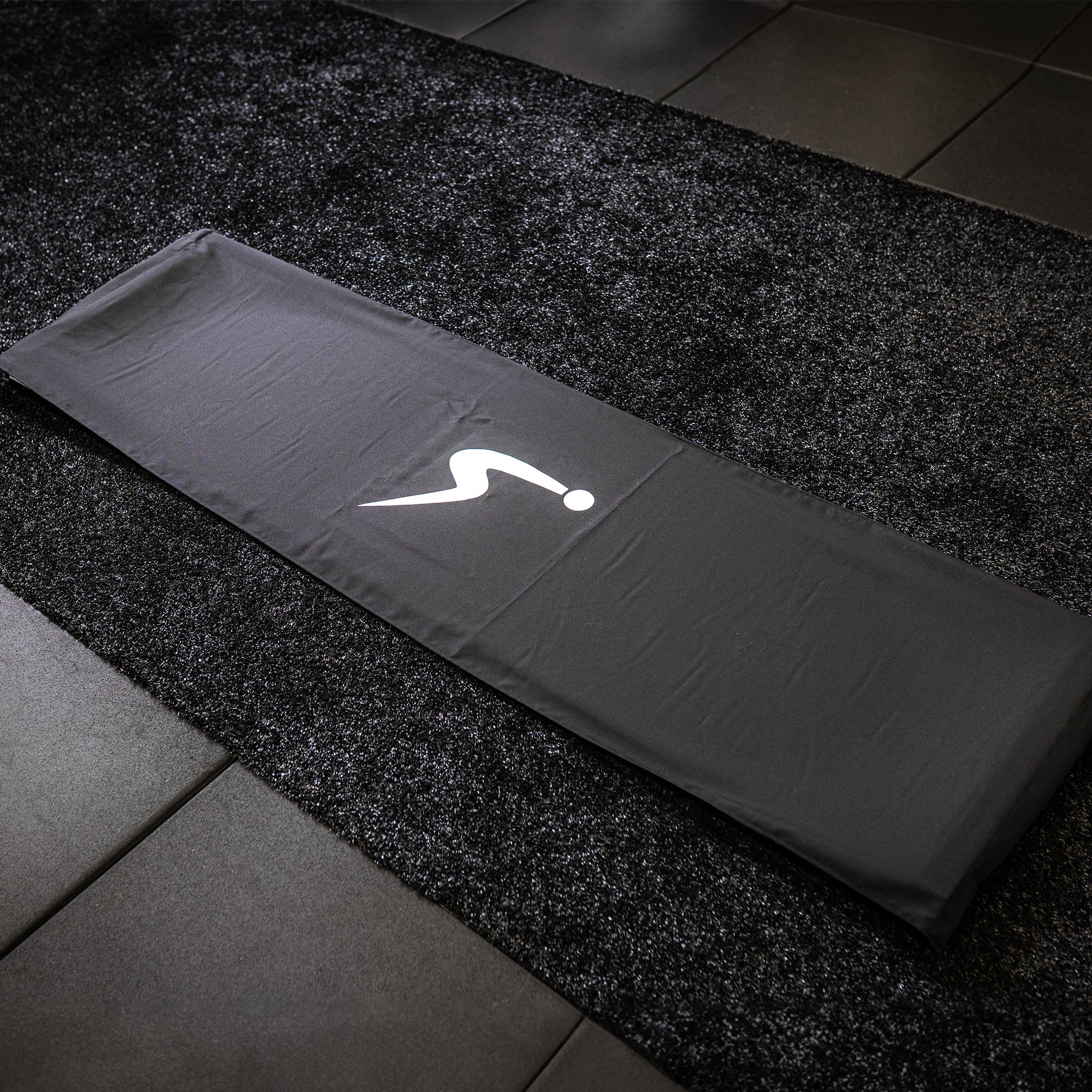 A fully covered ULTRASLIDE slide board on gym floor