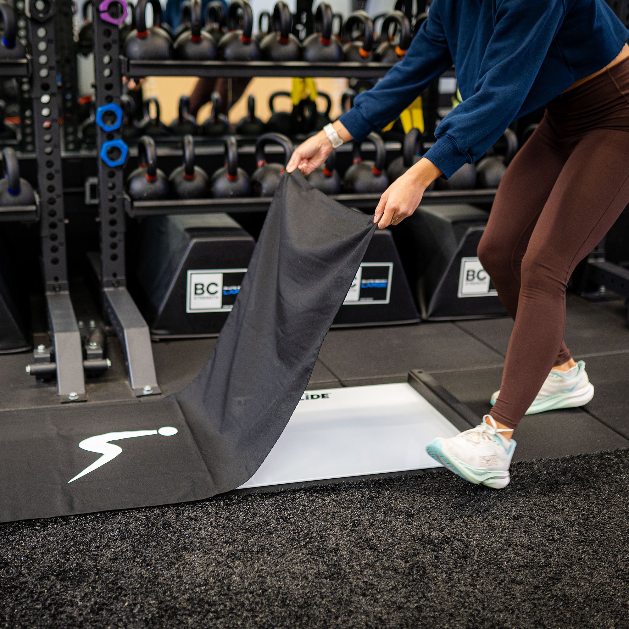 Person covering an ULTRASLIDE slide board with cover